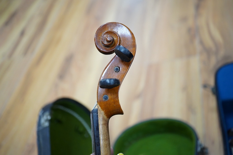 A quantity of violin parts and violins, a ukelele, a double bass scroll, a pinfold metronome, a violin case by Hill, a viola etc. Condition - for restoration